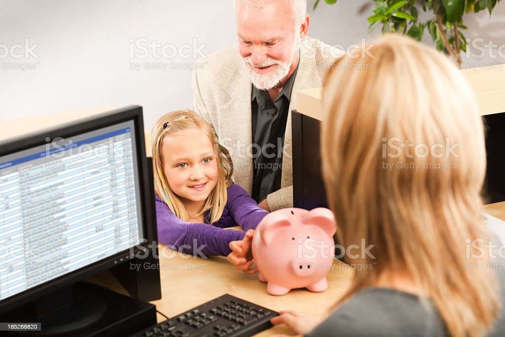Child Handing Coin Piggy Bank Opening Bank Account With Teller Stock ...
